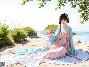 A woman in a kimono sitting on a wooden table.