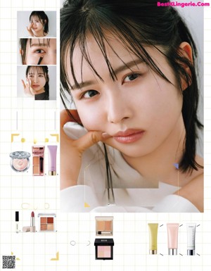 A woman in a white shirt is posing for a magazine.