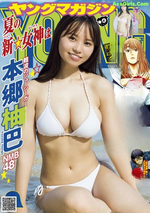 A woman in a white bikini standing on a beach.