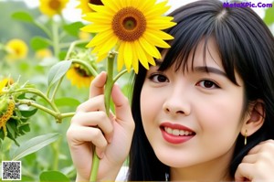 A woman with black hair is posing for a picture.